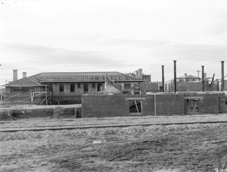 Hotel Canberra under construction, brickworks railway in front.