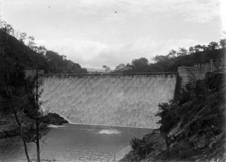 Cotter Dam wall, stilling pond and spillway from north side of gorge.