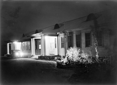 Front of Acton offices at night.