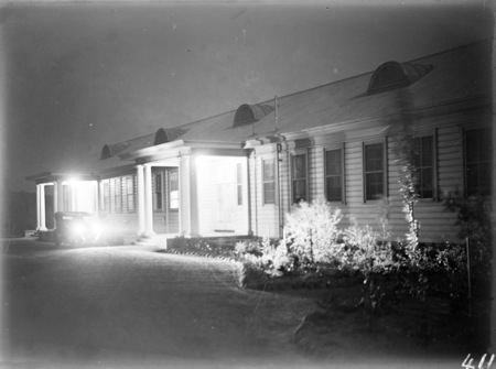 Front of Acton offices at night.