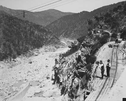 Burrinjuck Dam under construction River bed down stream from wall -movie cameramen on the right