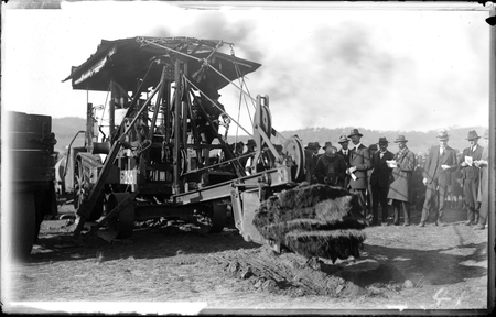 Turning of first sod for construction of Parliament House by the Minister for Works and Railways, Percy Stewart, with a Keystone steam shovel driven by Joe Lea.