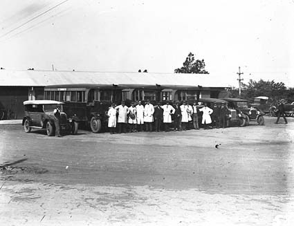 AEC Buses and cars with drivers and conductors(with the bag) at Kingston Bus Depot .See 585