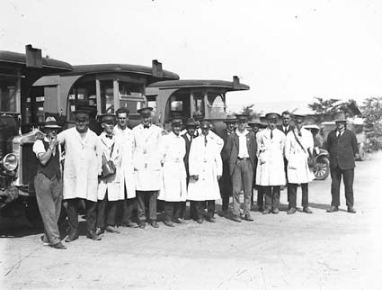 AEC Buses with drivers and conductors (with the bag).at the bus depot at Kingston Bus Depot