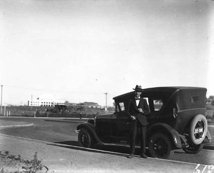 Mildenhall and his car outside the Hotel Canberra