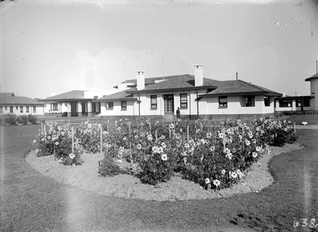 Hotel Canberra front entrance and flower gardens from the north