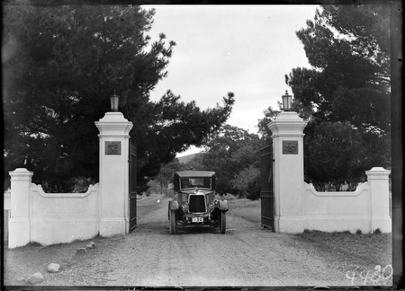 Amrmstrong Siddeley motor car emerging from the gates of Government House, Yarralumla.