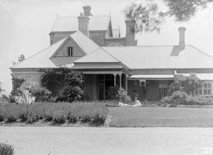 Government House, residence of the Govenor General, Yarralumla, old wing with groups on the front lawn