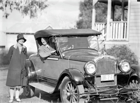 Mrs Adele Mildenhall and Mr Ivo Smith in his Pontiac roadster. Acton