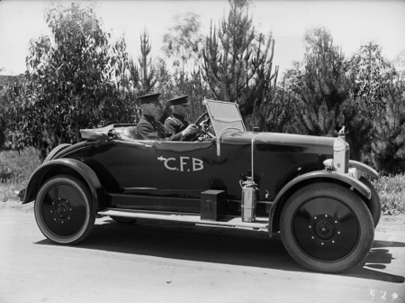 Chief Fire Officer Perc Douglass and Station Officer, Driver Bill Maloney, in official car (Armstrong Siddely).