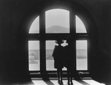 Parliament House. Adele Mildenhall and friend Althea Mouat looking out a window towards Mount Ainslie