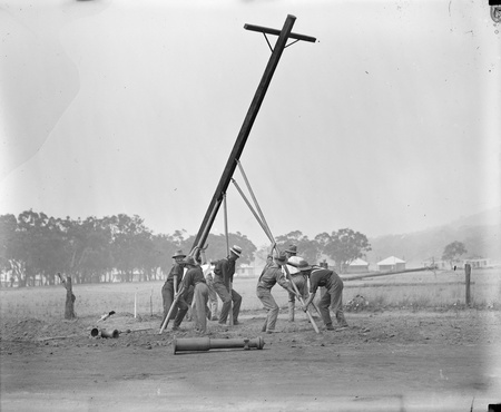 Power line pole being raised
