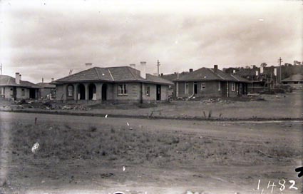 Oakley and Parkes houses under construction on corner of Melbourne Avenue and National Circuit