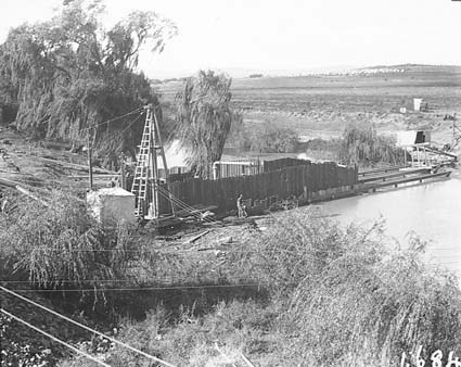Sewerage tunneling excavation workings on Monoglo River with camp in background