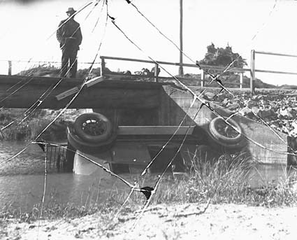 Motor car overturned in river