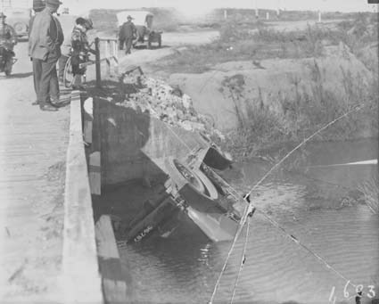 Motor car overturned in river