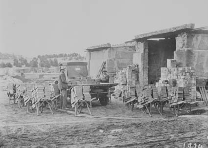 Loading bricks from storage onto a motor truck at Civic Centre