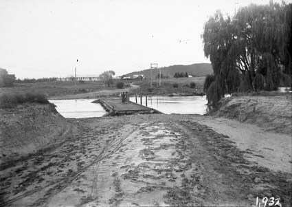Lennox Crossing showing Acton Offices and Molonglo river in flood