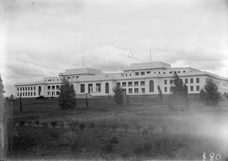 Parliament House frontage with advanced trees.