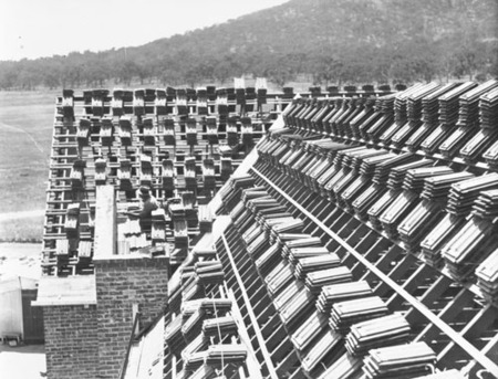 Tiles stacked on a roof - Ainslie Hotel, Limstone Avenue, Reid