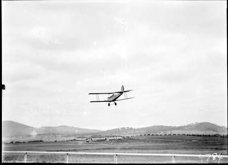 Aircraft landing on the review grounds in front of the Kurrajong Hotel.