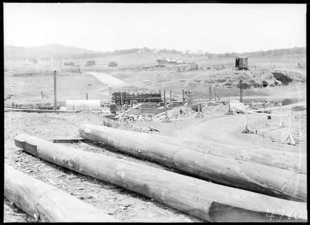 Scotts Crossing over the Molonglo River, under construction showing Blundell's Cottage.