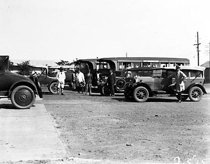 AEC Motor buses and Commonwealth motor cars with drivers at the Kingston depot