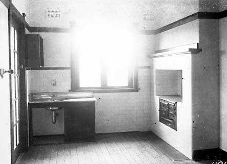 Cottage interiors,kitchen with wood stove and sink