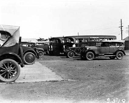 AEC Motor buses and Commonwealth motor cars with drivers at Kingston depot