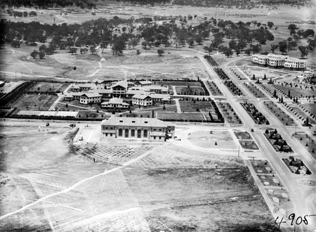 Aerial view over Commonwealth Bridge looking south showing Albert Hall, Hotel Canberra and West Block (negative reversed).