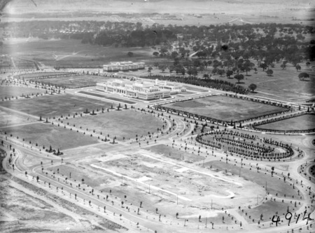 Aerial view over Parliament House and East Block. Treasury building foundations in front.
