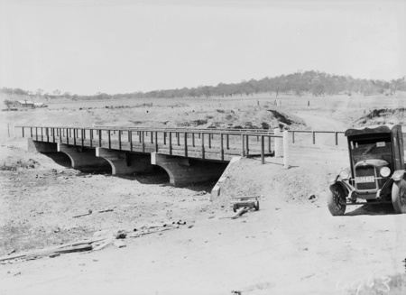 Scotts Crossing over the Molonglo River with Chevrolet motor truck in the foreground showing Blundell's Cottage in the left background.