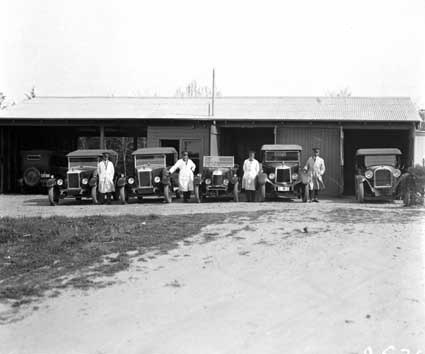 Six Federal Capital Commission motor cars with drivers at the Acton sub-garage - Drivers are (from left) Harold Strachan, George Edwards, Edward Tormey and Milton Purcell