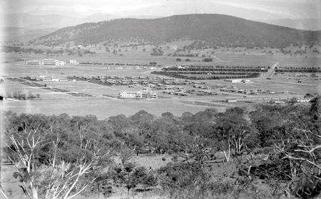 Braddon and Civic Centre from Mt Ainslie. Ainslie Hotel in the centre.Black Mountain at the rear