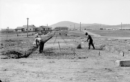 Roadworks in progress with manual labour