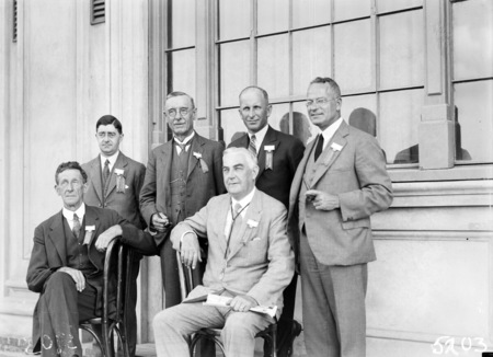 Second Conference of 65th District of Rotary. Delegates outside Albert Hall. Six executive committee members including Sir Robert Garran.