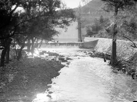 Cotter Dam Wall overflowing into the stilling pond and into the Cotter River.