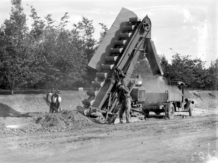 Bucket elevator  at work loading a motor truck
