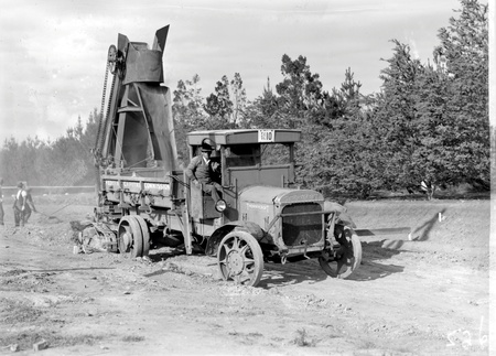 Bucket elevator  at work loading a Thorneycroft motor truck