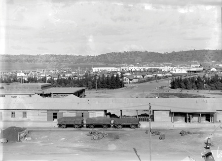 Kingston area and shops from the Kingston Power Station showing railway trucks loaded with coal
