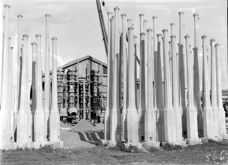 Concrete lamp standards in storage yard at Kingston Power Station