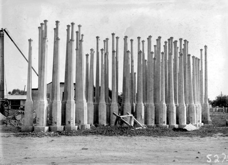 Concrete lamp standards in storage yard at Kingston Power Station yard