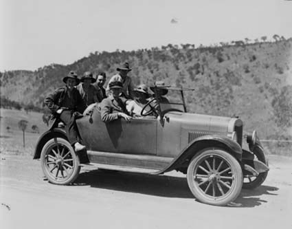 Picnic party in Chevrolet roadster on the road to the Cotter, Australian Capital Territory