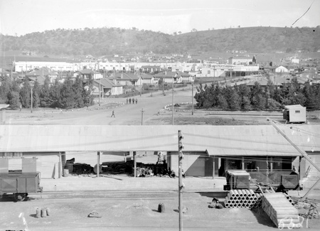 Kingston from industrial area near intersection of Giles Street and Wentworth Avenue. Concrete pipes being loaded into rail wagons