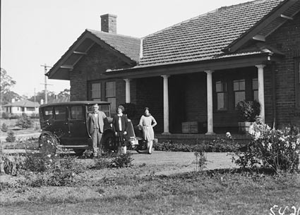 Senator  CW Marr with wife, daughter and Armstrong Siddeley  motor car in front of  their home at the corner of Dominion Circuit and Barkley Crescent