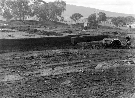 Australian Institute of Anatomy with Fordson tractor excavating the foundations, McCoy Circle, Acton