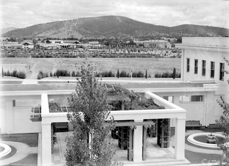 View to west from Parliament House courtyard. Hotel Canberra and Albert Hall in centre, Black Mountain in background