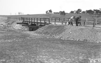 Bridge carpenters completing an unknown bridge