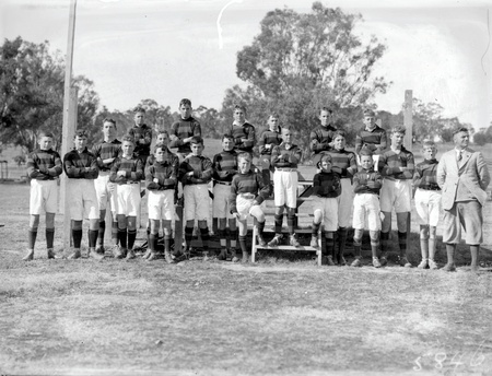 Group photograph of a school football team.