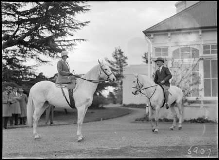 Lord Stonehaven and his wife on horseback (Lady Stonehaven is riding side saddle) at Government House, Yarralumla.